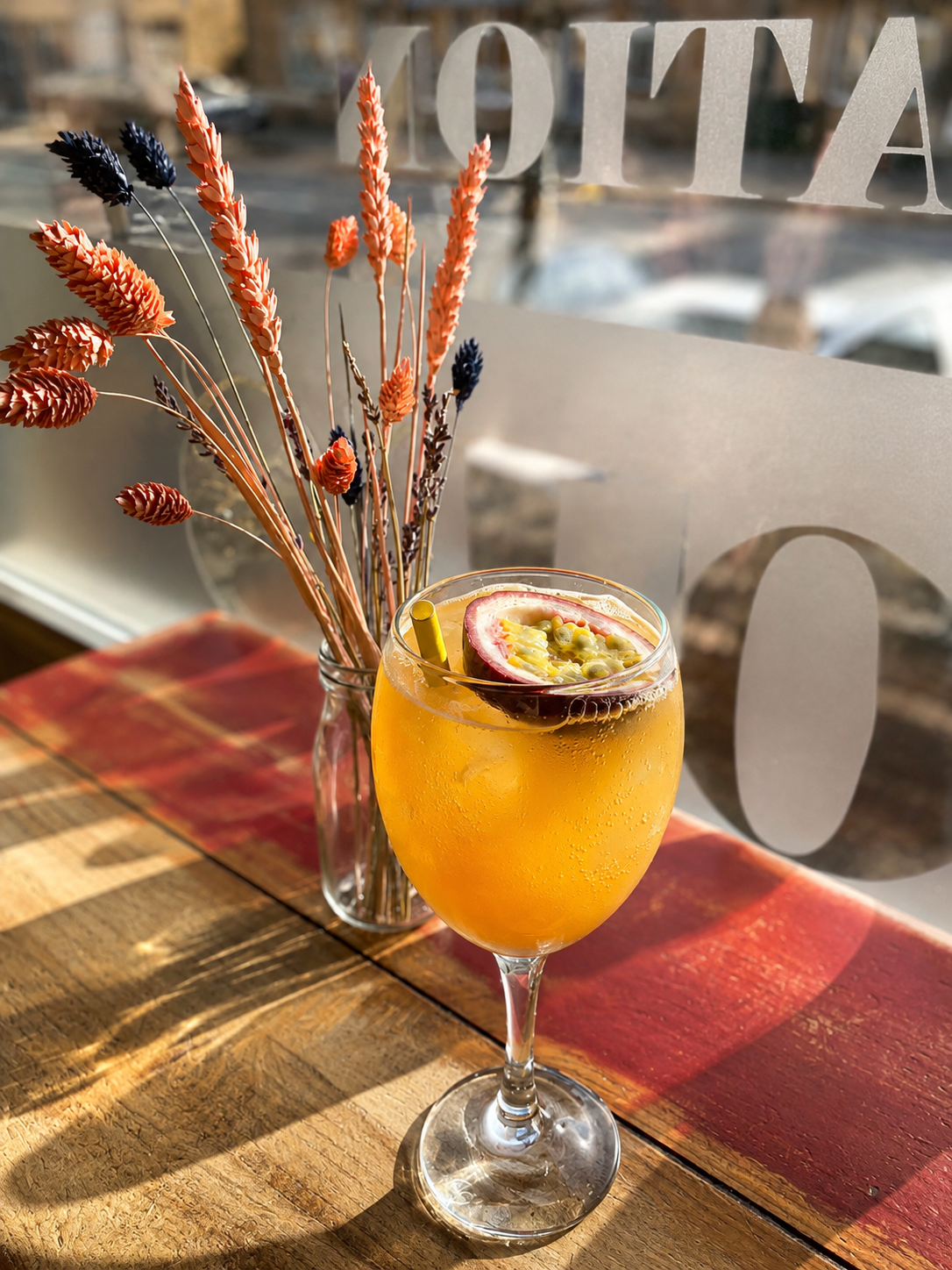 A passion fruit drink served by the cafe window