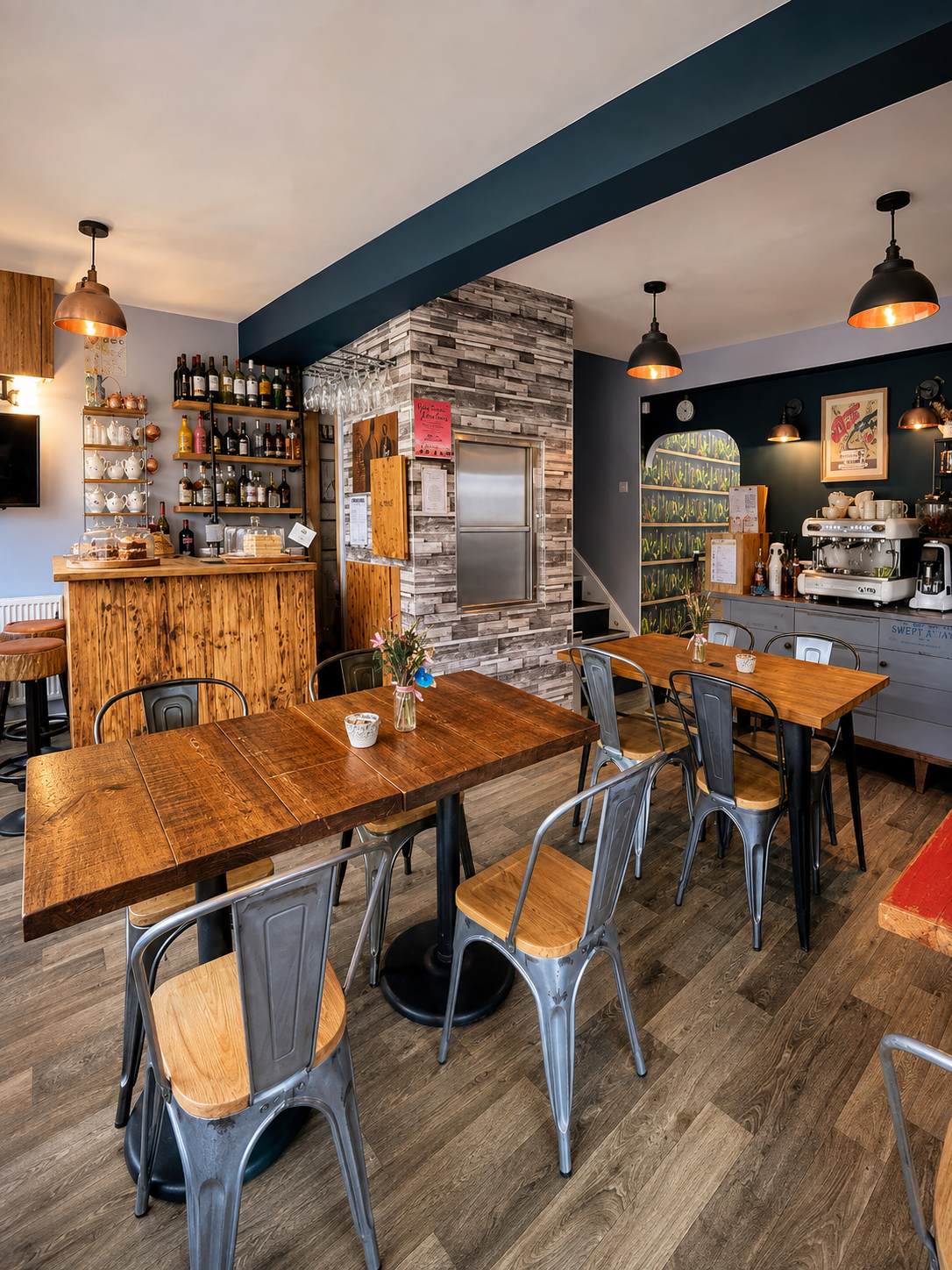 The cafe interior with wooden tables, bar seating and coffee equipment