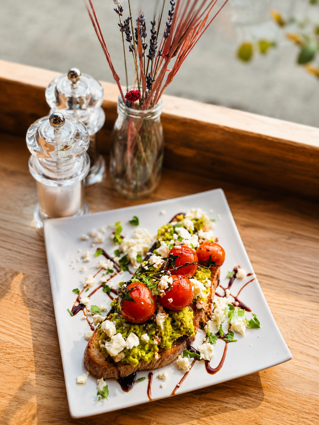 Avocado toast with roasted tomatoes and feta