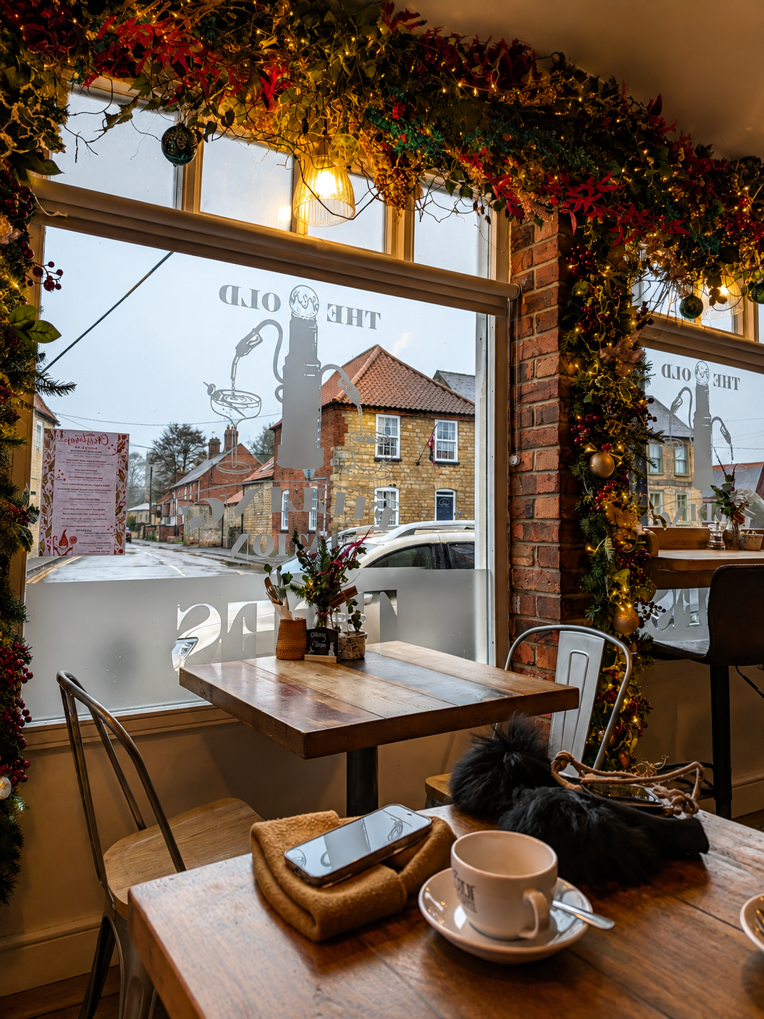 Window seating with festive garlands and a view of Navenby